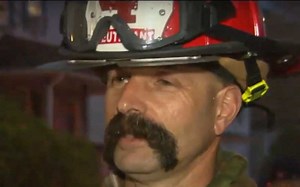 Irish American former Marine firefighter battles flames to save American flag