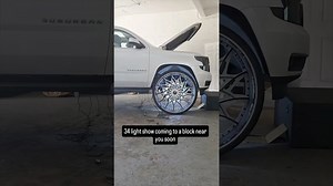 White Chevy Suburban on 34”s