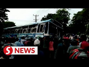 Anti-government protesters damage buses, set fire to homes in Sri Lanka