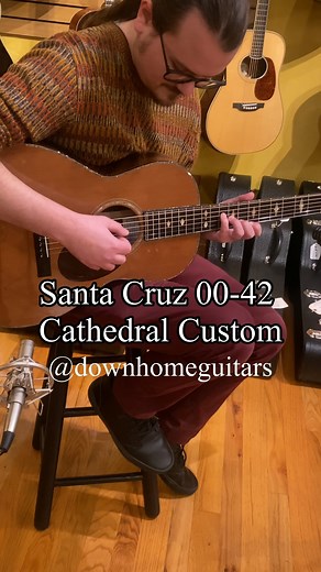 A stunning guitar with hallowed origins, This 00-42 custom from Santa Cruz Guitar Co. is built with extremely rare 125 year old Brazilian Rosewood sourced from the historic Bryn Athyn Cathedral in Pennsylvania paired with rare 200 year old Redwood from the Fort Ross Chapel, a National Historic Landmark church on the coast of CA. Dazzling Gold Pearl and Mother of Pearl Moderne inlays adorn the fretboard complemented by Abalone Pearl 42-style top purfling and rosette with matching fretboard and he