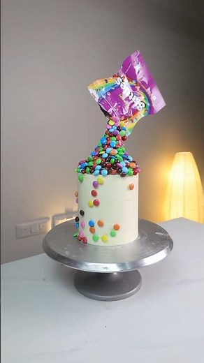 Make this super realistic gravity cake with skittles!!