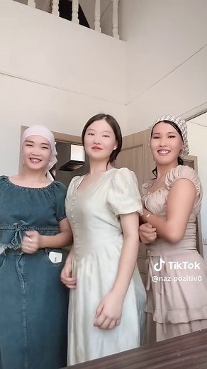 Coordinated Hand-Clapping Routine in Stylish Dresses
