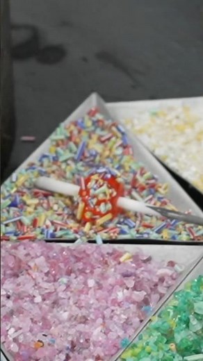 Process of making glass beads. A Japanese factory that makes glass jewelry.