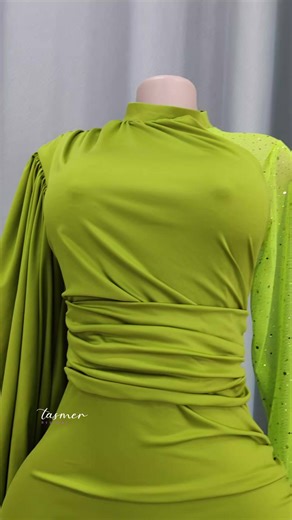 olive-green long-sleeved dress featuring a ruched waist and a high neckline. #longsleevedress #classydress #elegantstyle #creatorsearchinsights