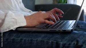 Woman Typing On A Laptop Computer