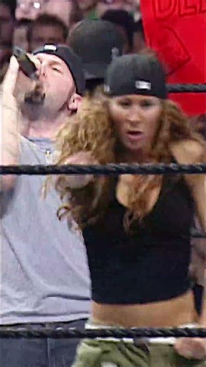 Undertaker daps up Fred Durst while entering WrestleMania 19 to “Rollin’” by Limp Bizkit.