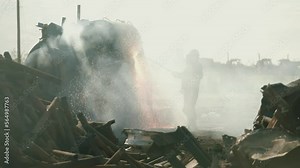 Metal Torcher cutting metal at a scrap yard in slow motion with fire and sparks