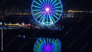 Seattle Waterfront Aerial with Ferry Boat Passing Pier at Night