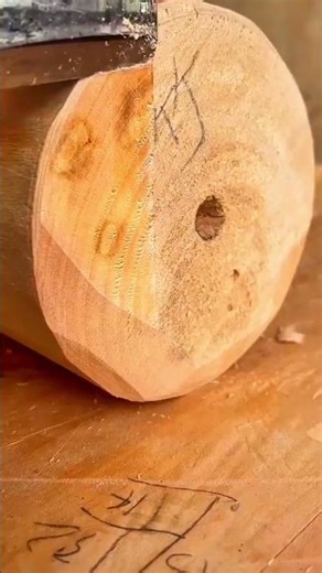 Shaving a small wooden block with a sharp hand chisel for a precise and smooth craftsmanship