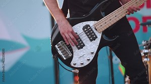 Guitar player playing in a musical group, guitar player performing, a musical group performing on stage