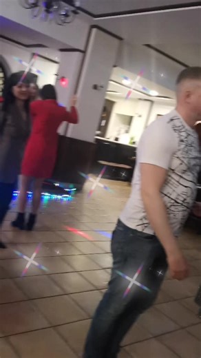 Dancing and Socializing in a Vibrant Indoor Venue