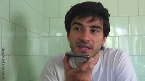 Man using vocal assistant and sending vocal message. Man using technology Stock Video