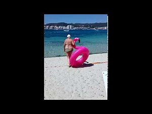 Woman Gets Stuck Inside Inflatable Pink Flamingo Float || ViralHog