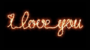 Download The inscription I love you burns with fire, flame on a dark background for free