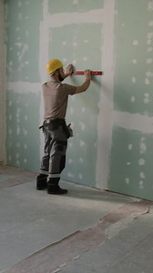 Construction worker installing drywall | Free Stock Video Footage