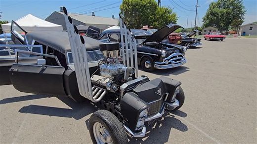 wild custom hearse next to a stock vintage hearse | Samspace81