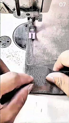 Sewing fabric using machine with manual hand guidance