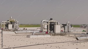 Air compressor machine part of air conditioner system on roof deck with sky background