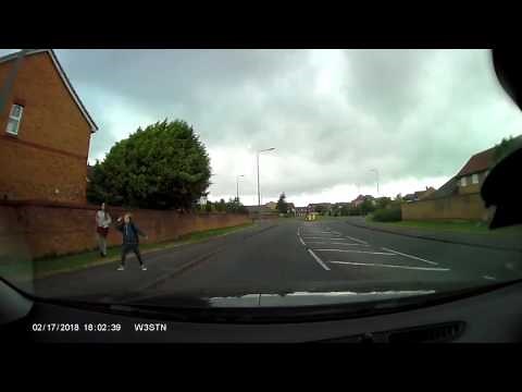 Kid throws rock at car