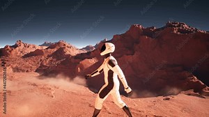A brave astronaut walks across the deserted red planet Mars. Astronaut Martian colonizes and explores Mars. Looping animation is designed for futuristic, sci-fi, space travel. Space travel concept.