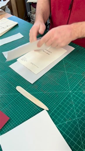 Big River Bindery on Instagram: "Preparing this book for a double fan adhesive binding. I add hinges in the front and back to help attach the cover back onto the book. Ready for gluing. #bookconservation #doublefanadhesivebinding #japanesepaper #bookrepair #torontobookarts"