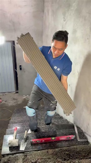 Stair tiling process recorded. One step at a time.