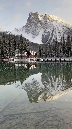 Serene Winter Landscape with Frozen Lake and Mountains