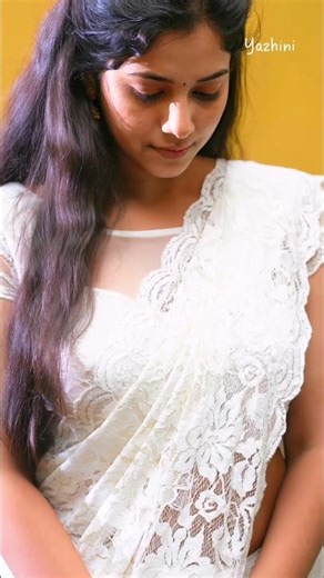 Sheer white lace saree paired with a matching lace crop blouse | Yazhini White Saree Fashion