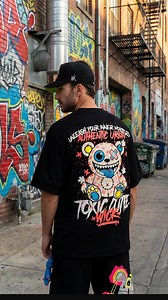 ⚡ NEON ICE Chaos Unboxing ⚡ This piece from the new NEON ICE drop is now live — exclusive style, exclusive attitude. Get ready… this Toxic Black T-Shirt didn’t come to play. Premium oversized cut, heavyweight cotton that falls solid, soft, and built like armor. Neon ink screen-print ice-glaze details, made to glow even in the shadows. TOXIC CUTE artwork: sweet chaos, dangerous smile, full monster vibe. 🔥 AWAKEN YOUR INNER MONSTER | Wickmonsters