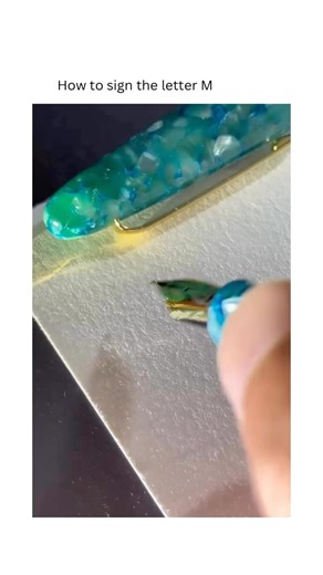 Calligraphy Videos on Instagram: "M — a handshake drawn in angles. Two uprights rise from the baseline; inside them, a pair of slanting strokes descend and return, touching once like agreement before letting go. The spaces they frame are small lanterns of white—light held on purpose so the strength doesn’t harden. You can hear it as mmm—a chest-deep hum, the body saying yes before the mouth finds words. On the page, that feeling becomes structure: not one tower, but a four-beat cadence—up, down,