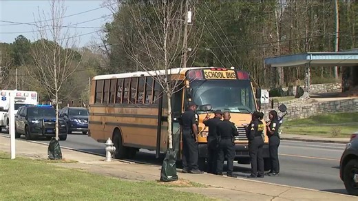 Gunman at large after shooting at school bus