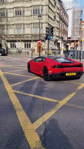 Sparkling Lamborghini moves through traffic