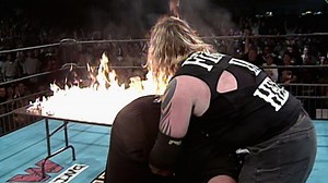 Balls Mahoney slams Angel through a flaming table: ECW November to Remember 2000