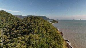 Trinity Beach, Cairns, Queensland: A view from Roci point, 4K Aerial Drone Footage Featuring Scenic Shoreline, Taylor Point, Coral Sea, Palm Fringed Town, Coastal Hotels, and Lush Tropical Forest