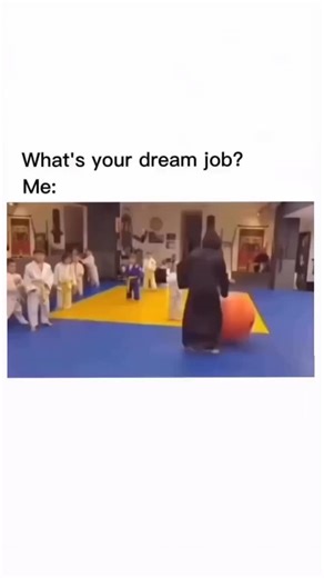 Meme Dekh 👇 on Instagram: "The post shares a 19-second video meme showing a martial arts instructor in black playfully rolling a large orange exercise ball into giggling children on a dojo mat, overlaid with "What's your dream job? Me:", captioned "I’d be great at this…", capturing the appeal of carefree, chaotic fun in teaching. Authored by @One_Way_Home , a self-described Christ-following political nomad, on 7 February 2026, it quickly amassed 3,895 likes, 546 reposts, and 299,716 views, indi