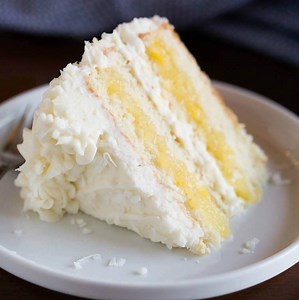 The most amazing COCONUT CAKE with PINEAPPLE FILLING and whipped coconut cream cheese frosting. https://tastesbetterfromscratch.com/coconut-cake-with-pineapple-filling/ | Tastes Better From Scratch