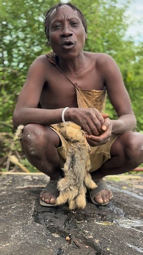 Hadzabe hunter enjoying new food 🥘 #hadzabetribe #hadzabelifestyle #hadzabebushman #bushcraft #bushlife #bushman #wildlife #africa #fyp #viralvideo | Vinod Kumar