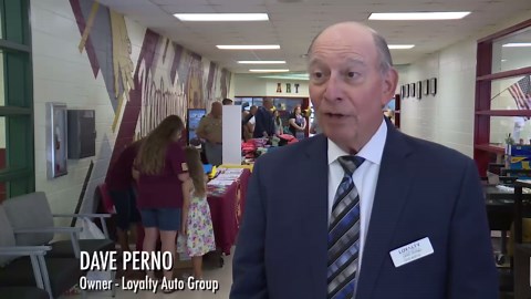 Elementary school students in Colonial Heights receive backpacks and school supplies