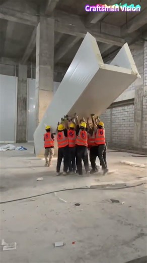 Manual Installation process of foam boards for wrapping load bearing columns in workshop