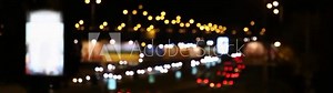 Blurry cars driving along city road at night. Video of night traffic lights