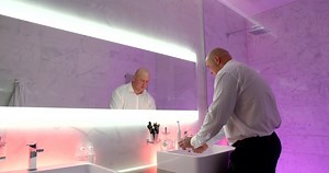 Bald man explains where face ends and head begins (for face-washing advice)