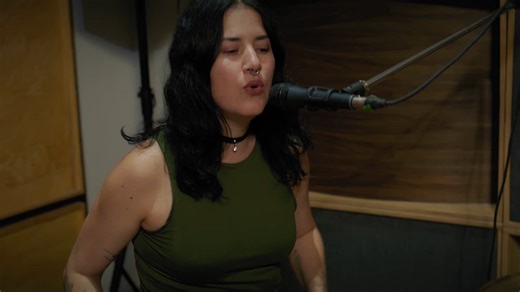 Female drummer playing and singing in the studio - Free Stock Video