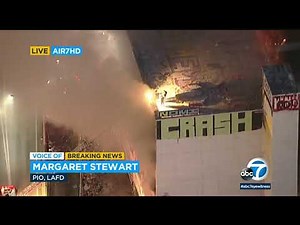 Multiple people left stranded on roof of downtown LA building after fire erupts | ABC7