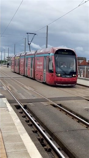 Nottingham Express Transit 214 departs Nottingham Station with a Toton Lane to Hucknall