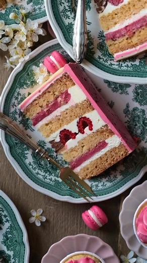 Easter cake💓🐇 •Part 1 Four Moist marzipan cake layers meet tangy raspberry curd, airy chocolate mousse, fresh raspberries and smooth vanilla buttercream✨ 🍰Cake: Add 200g grated Marzipan to 350g Almond milk, stir until the marzipan has dissolved. Add 1 tbsp acv, 75g oil, 1 tsp almond extract. Sift together 335g flour, 15g cornstarch, 200g sugar, 12g baking powder, 3g baking soda, 1/2 tsp salt. Add 40g chopped almonds. Combine wet and dry ingredients, divide the batter into two 18cm pans. Bake 