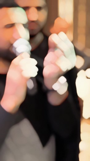 Engaging Performance with Microphone in Black Jacket