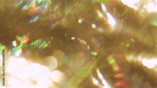 Defocused twinkle texture. Gradient reflection. Bokeh colorful glimmer mix flare in glass prism. Abstract yellow golden luminosity glitter background.