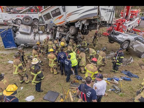Jacksonville Fire Rescue Department has one trapped w/RV on a truck requiring technical rescue team