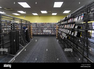 Inside of a closing Blockbuster Video movie rental store in Alaska. Store is holding a liquidation sale for going out of business Stock Photo - Alamy