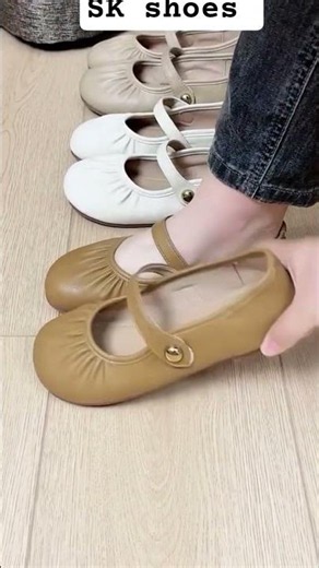 Mary Jane ballet flats with a ruched (gathered) round toe and a single strap across the foot.They